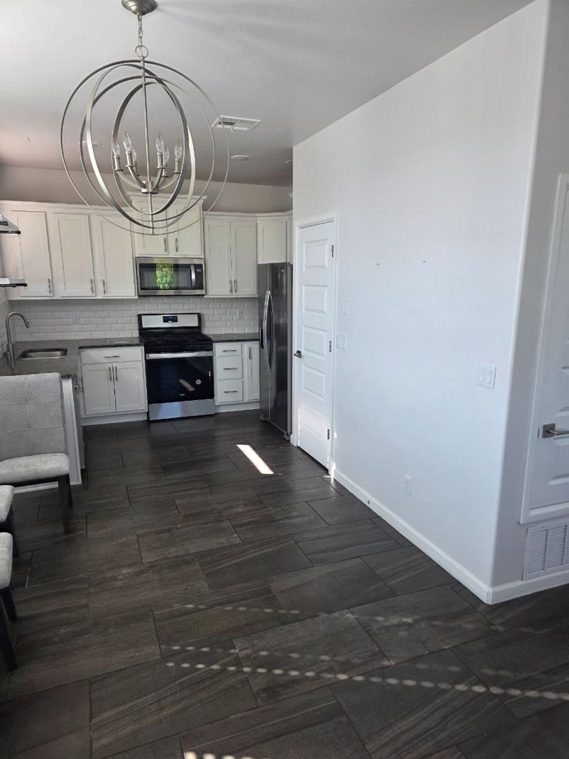 Empty kitchen and living area before staging, Las Cruces NM