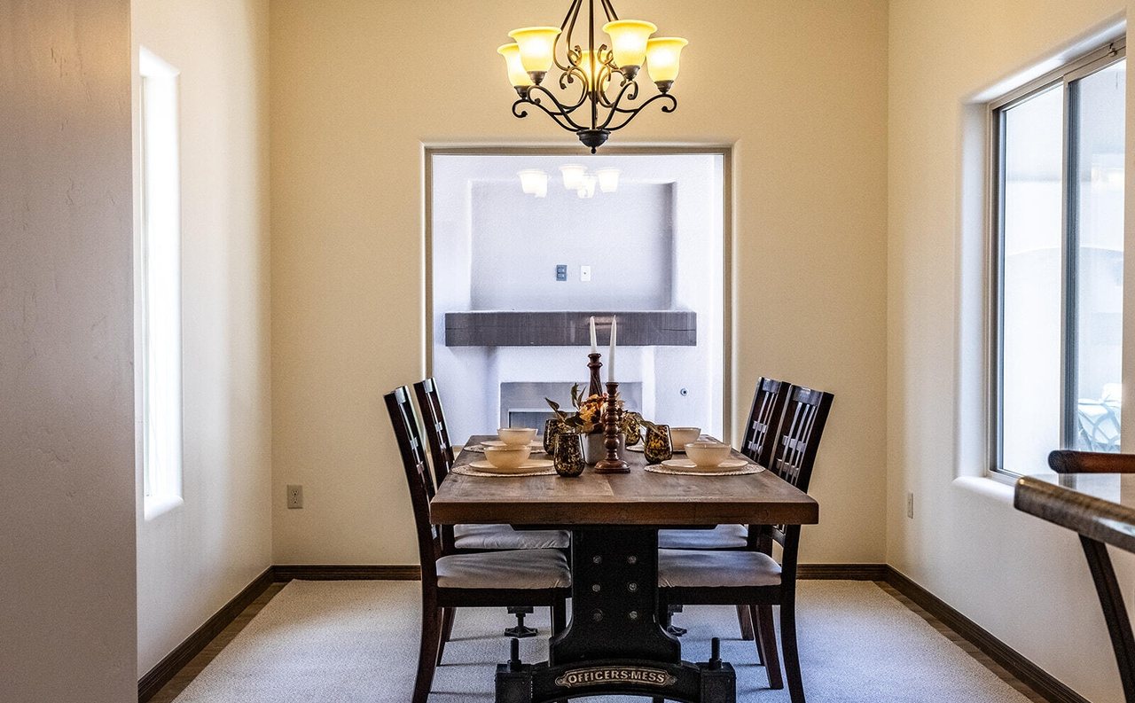 Finished formal dining room with trestle table and chandelier, Sedona Boulders