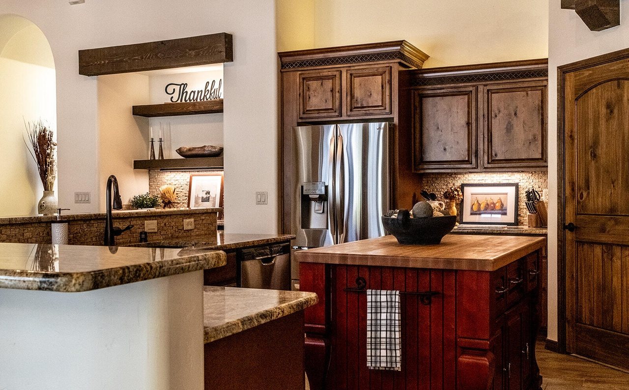 Finished kitchen with butcher-block island and styled shelves, Sedona Boulders