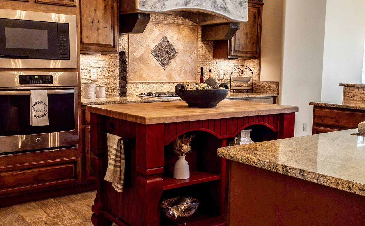 Finished staged kitchen with red island, ready for listing photos, Sedona Boulders